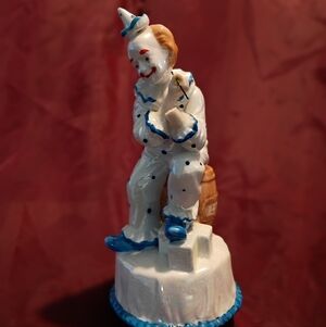Porcelain Clown Figurine with Blue Accents